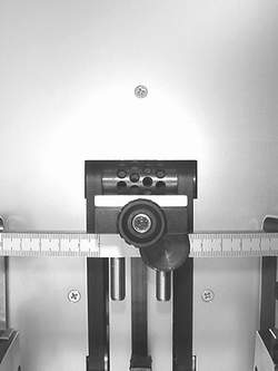 Agor own-site detail photo #1 of the PHS 460 (from phs460detalles_01.JPG) — air feeder, fed-product samples, and the twin rotary finishing shafts with support arms, wheels and hard-steel base rings