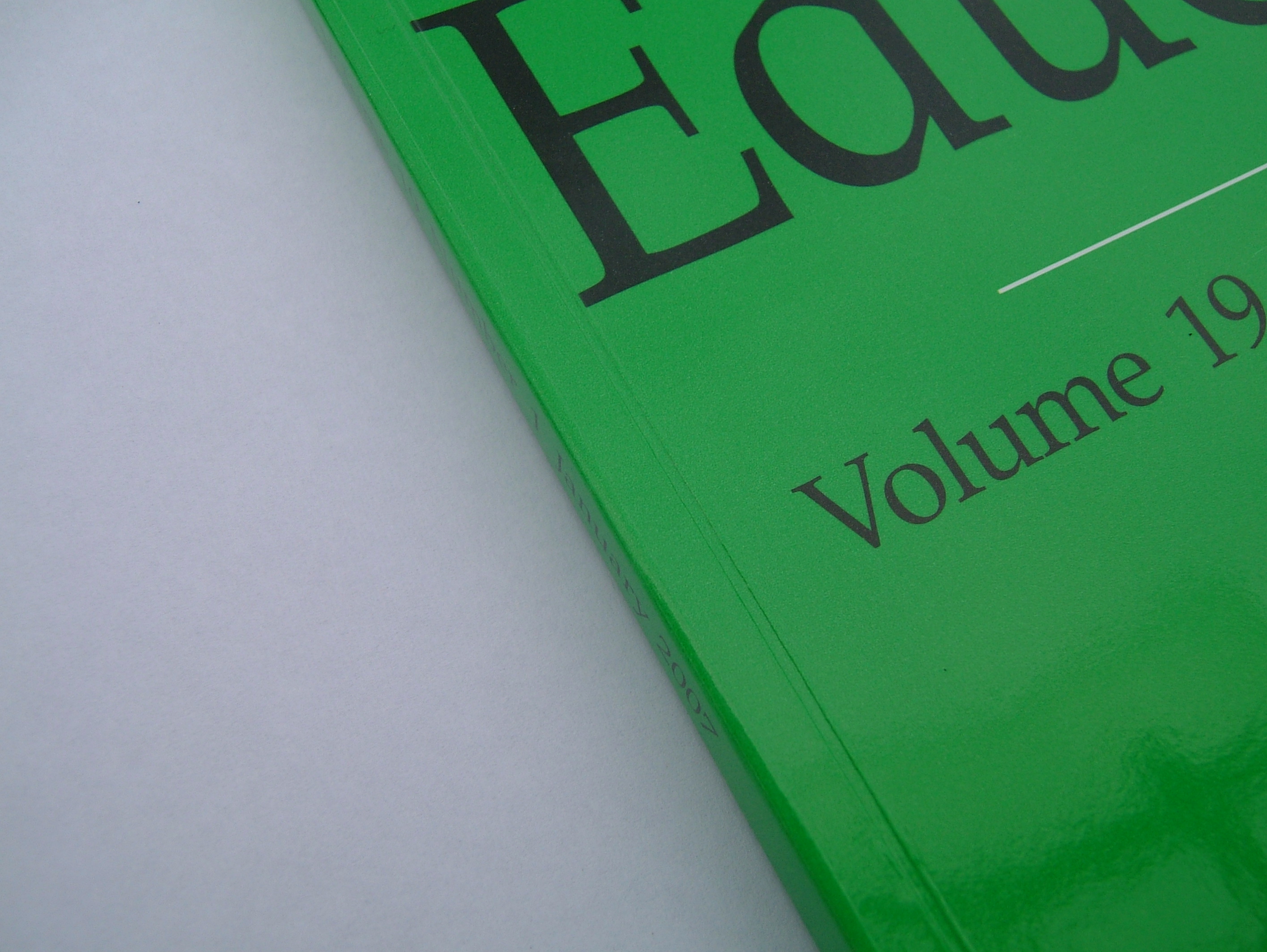 Glossy laminated journal cover with a crisp pressed hinge crease, film intact