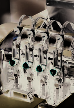 CP Bourg BM-e stitch module — wire-stitch heads over the saddle (Xerox brief photo)