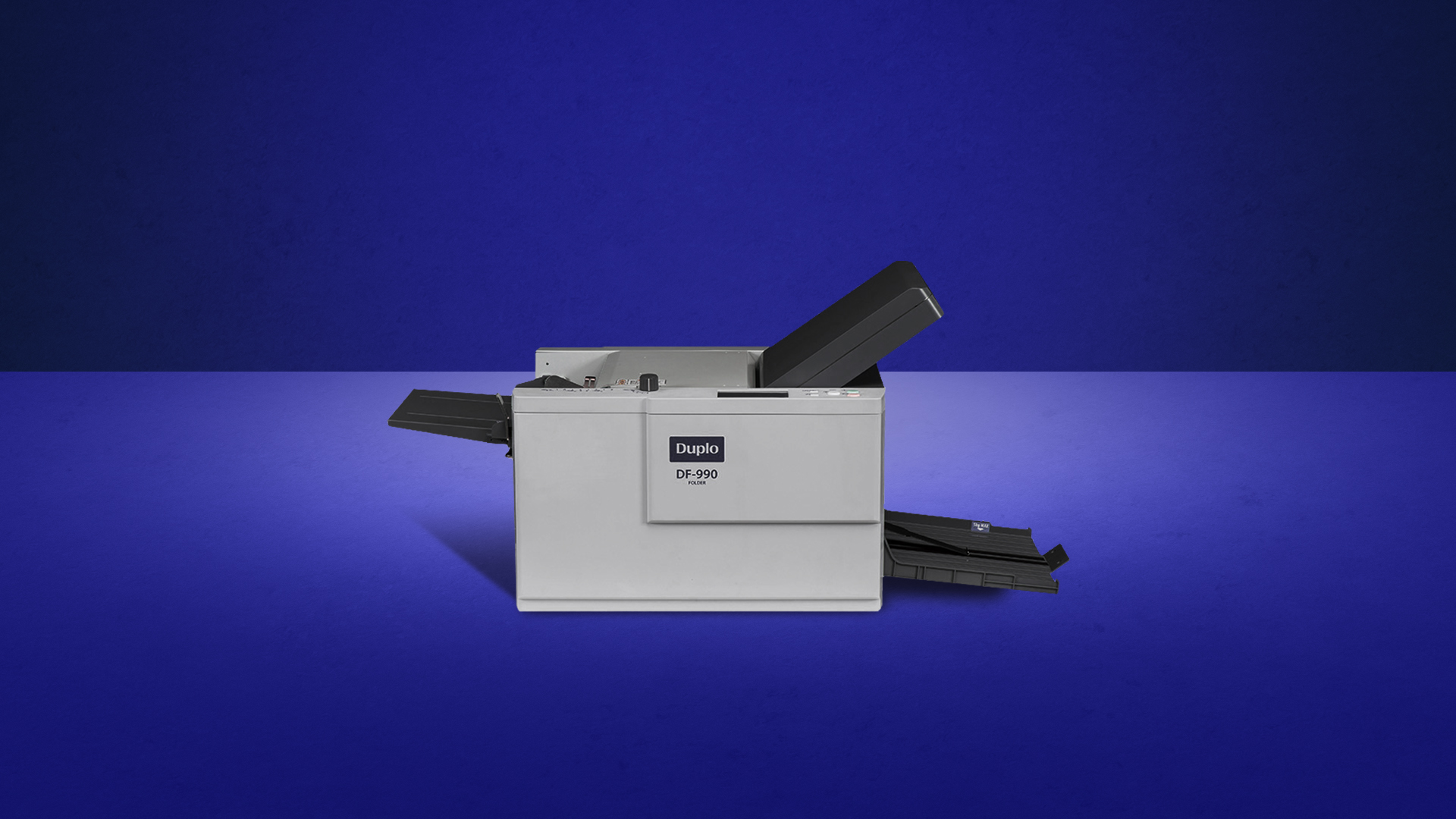 Duplo DF-990 suction paper folder — official product photo (shown on Duplo's DF-999 page; cabinet plate reads DF-990)