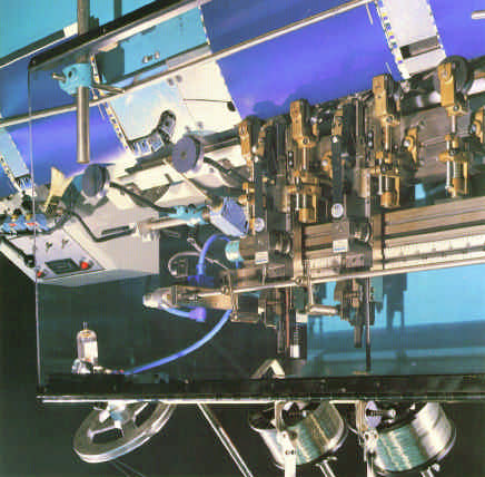 McCain S2000 Hohner stitching-head and clincher assembly over the gathering chain — official brochure photo (OEM defunct)