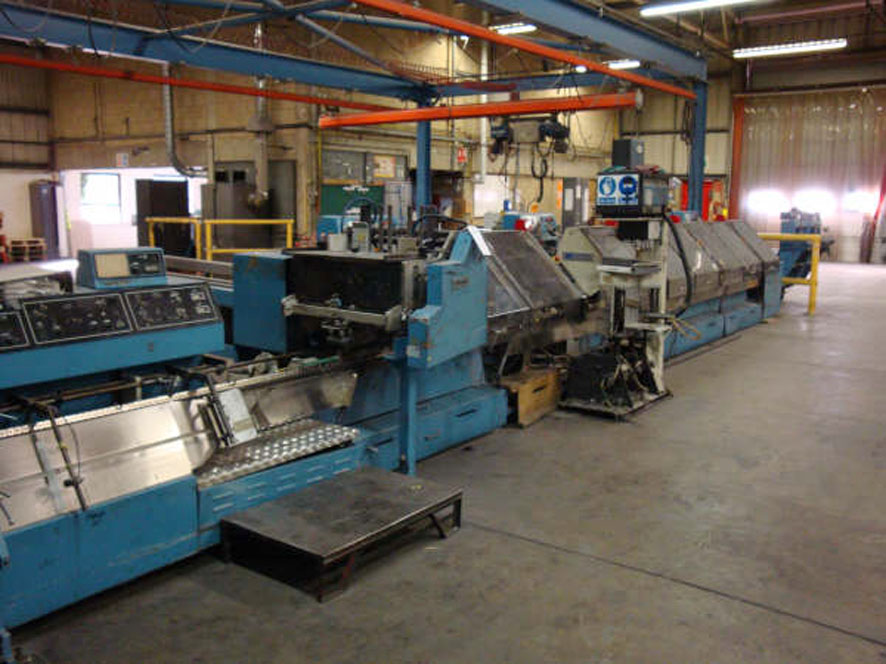 Sheridan/Harris SP 705 saddle stitcher-gatherer line — dealer photo (Exapro, dead OEM)