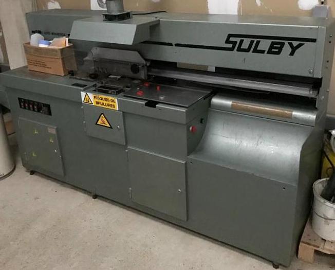 Sulby Auto-Minabinda single-clamp monobloc perfect binder, SULBY badge — dealer photo (Exapro)