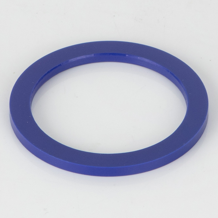 Single flat blue plastic spacer ring on white background