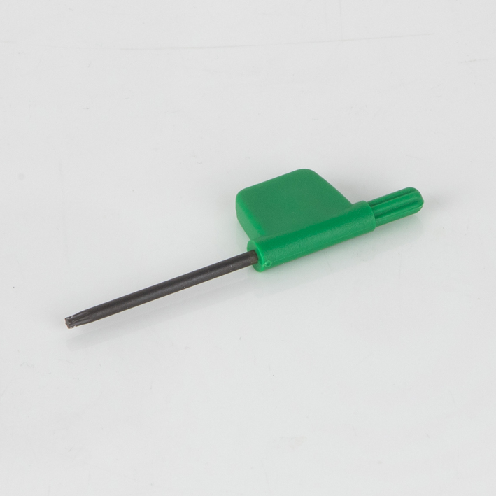 Green flag-handle torx key on plain studio background