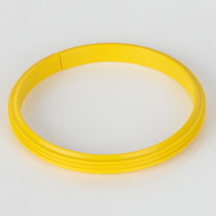 Yellow split female receiver ring on white background