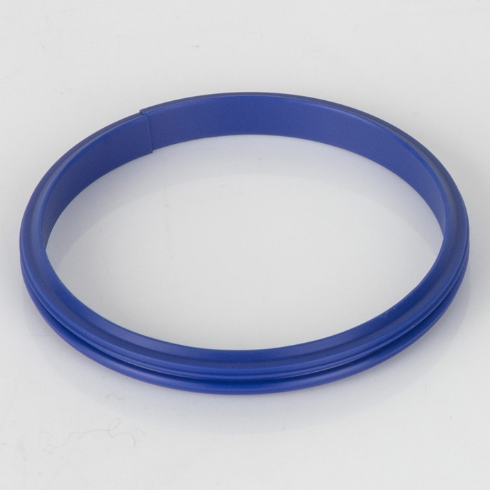 Blue split female receiver creasing ring, studio shot