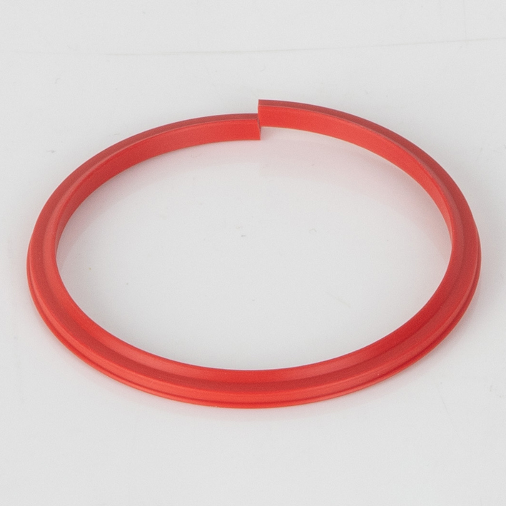 Red flat-sided plastic split creasing rib on white background