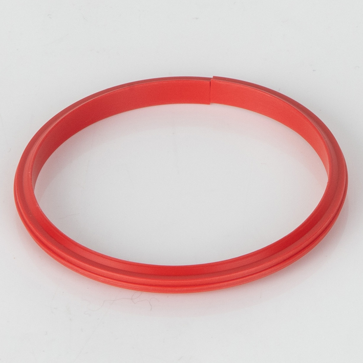 Red split plastic creasing rib for Quad-Creaser, studio shot