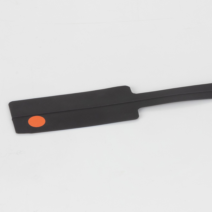 Black creasing matrix spade strip with orange colour-code dot, studio white background