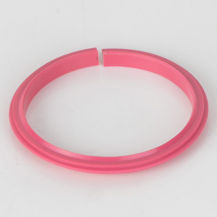 Pink split plastic creasing rib on white background