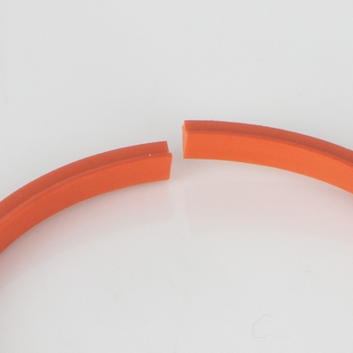 Close-up of split gap in orange creasing rib ring