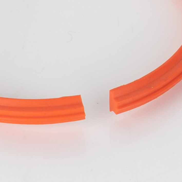 Close-up crop of orange split gripper crease rib joint gap