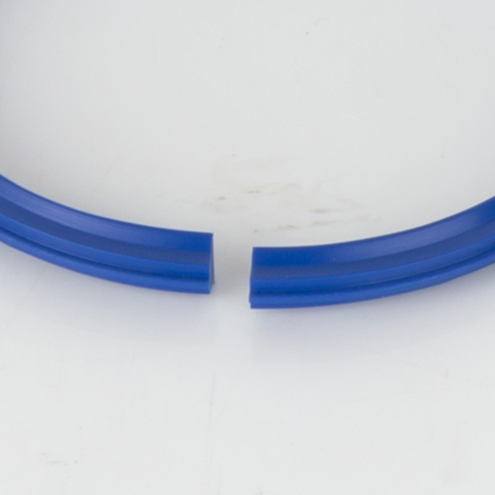 Close crop of blue split gripper crease ring gap on white background