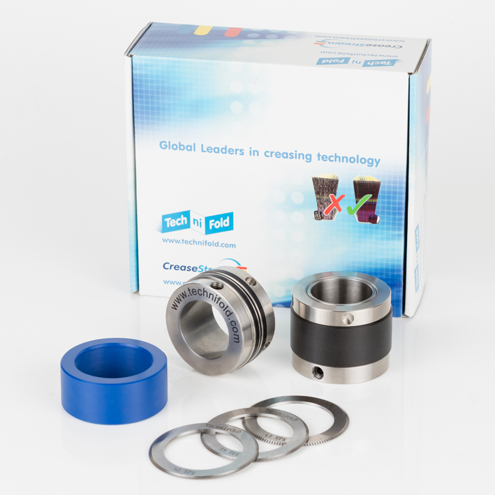 Micro-perf kit packshot: retail box, steel holders, blue sleeve, three blades
