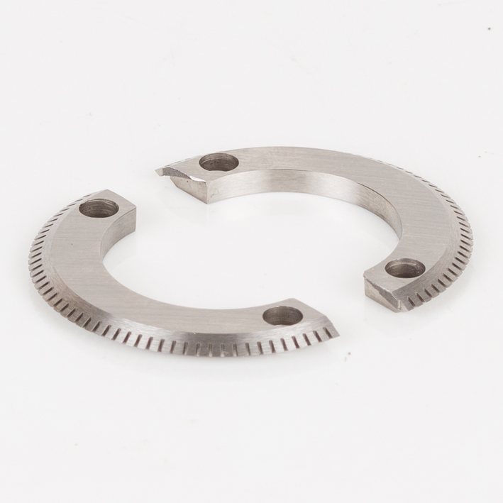 Two semicircular steel perforating blade halves with bolt holes