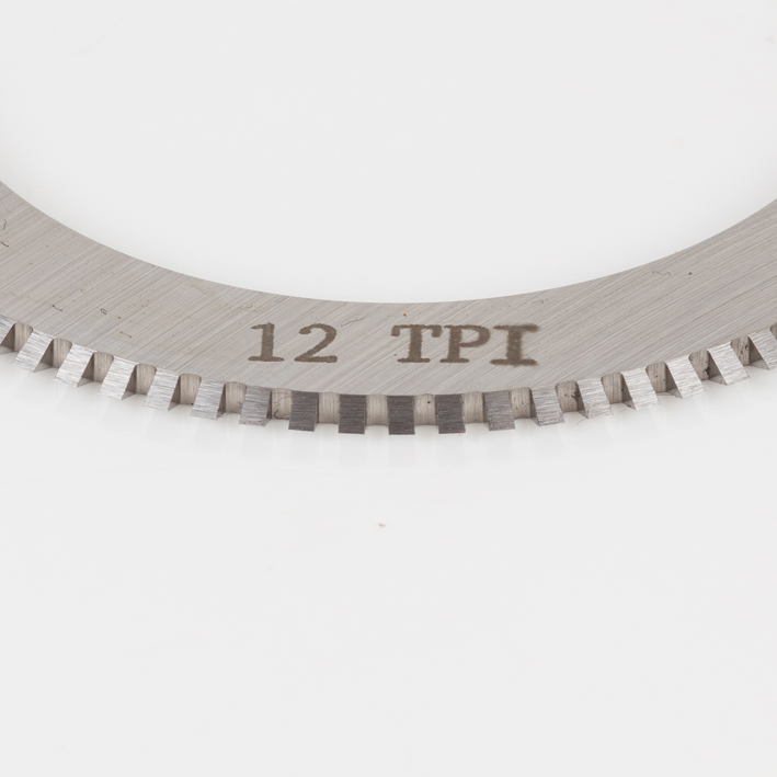 Close-up of 12 TPI micro-perf blade teeth and engraving