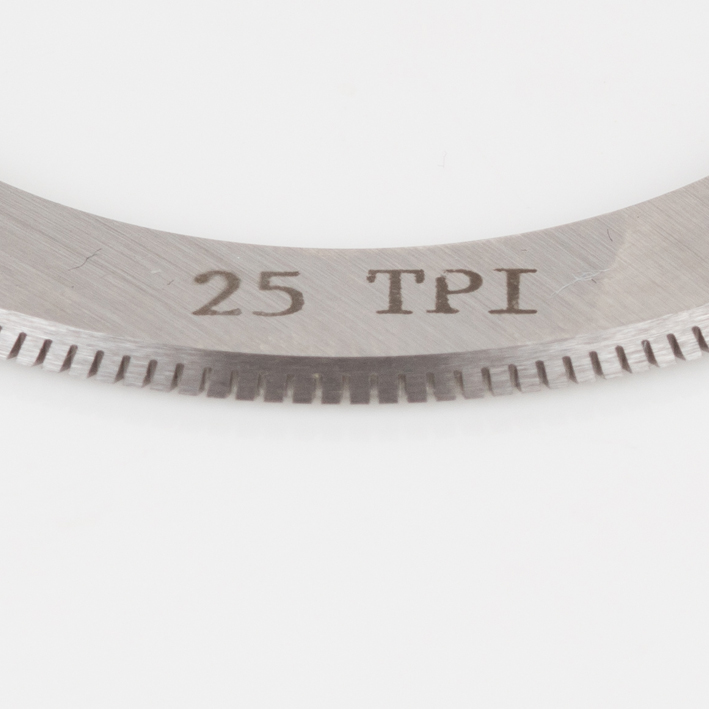 Close-up of 25 TPI micro-perf blade teeth and engraving