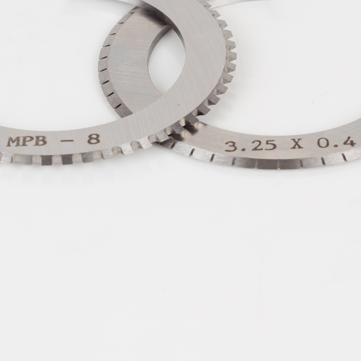 Cropped close-up of MPB-8 and 3.25x0.4 blade engravings