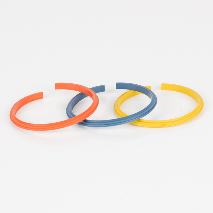 Three split gripper crease bands spread out: orange, blue-grey, yellow