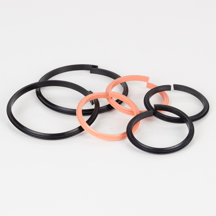 Selection of black and salmon split rubber creasing ribs in a pile