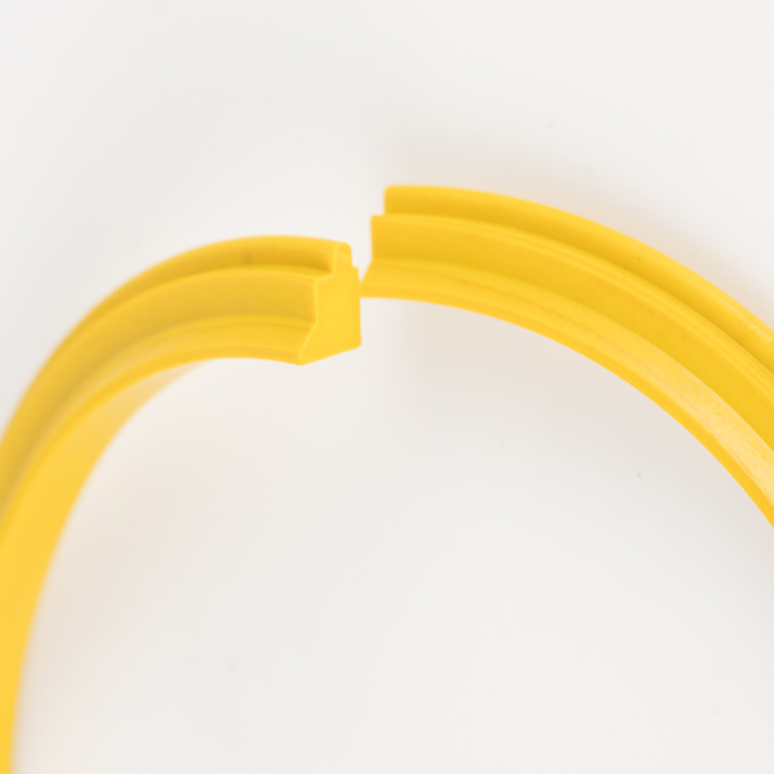 Yellow creasing rib split-joint macro close-up showing profile grooves