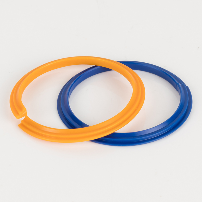 Orange and blue split plastic creasing ribs overlapping, white background