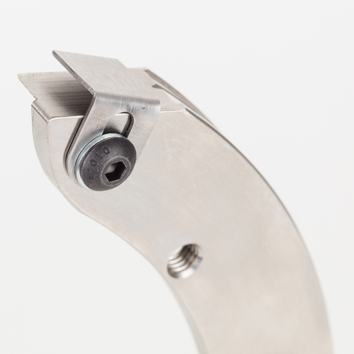 Close-up of steel matrix holder clamp with hex screw