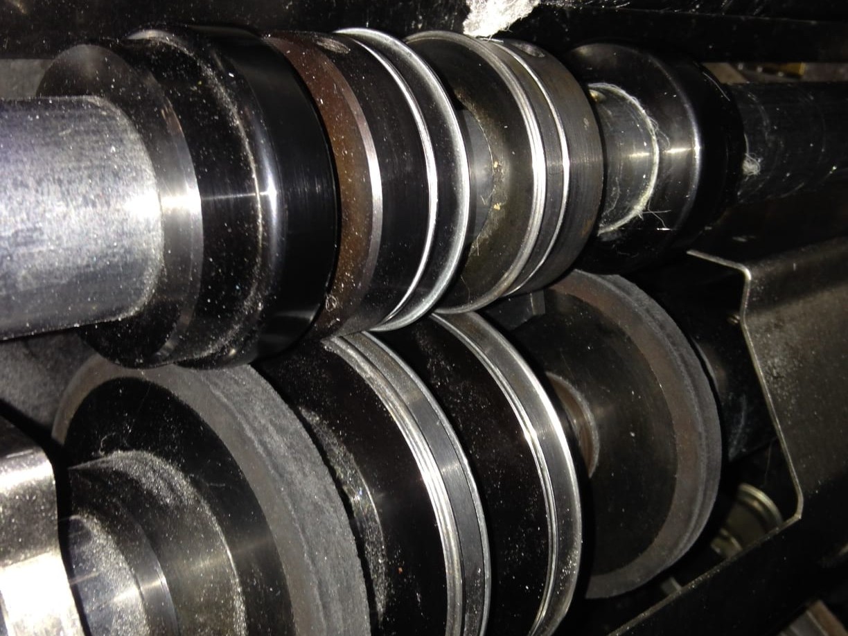 The steel scoring discs fitted as standard in a perfect binder's cover scoring section